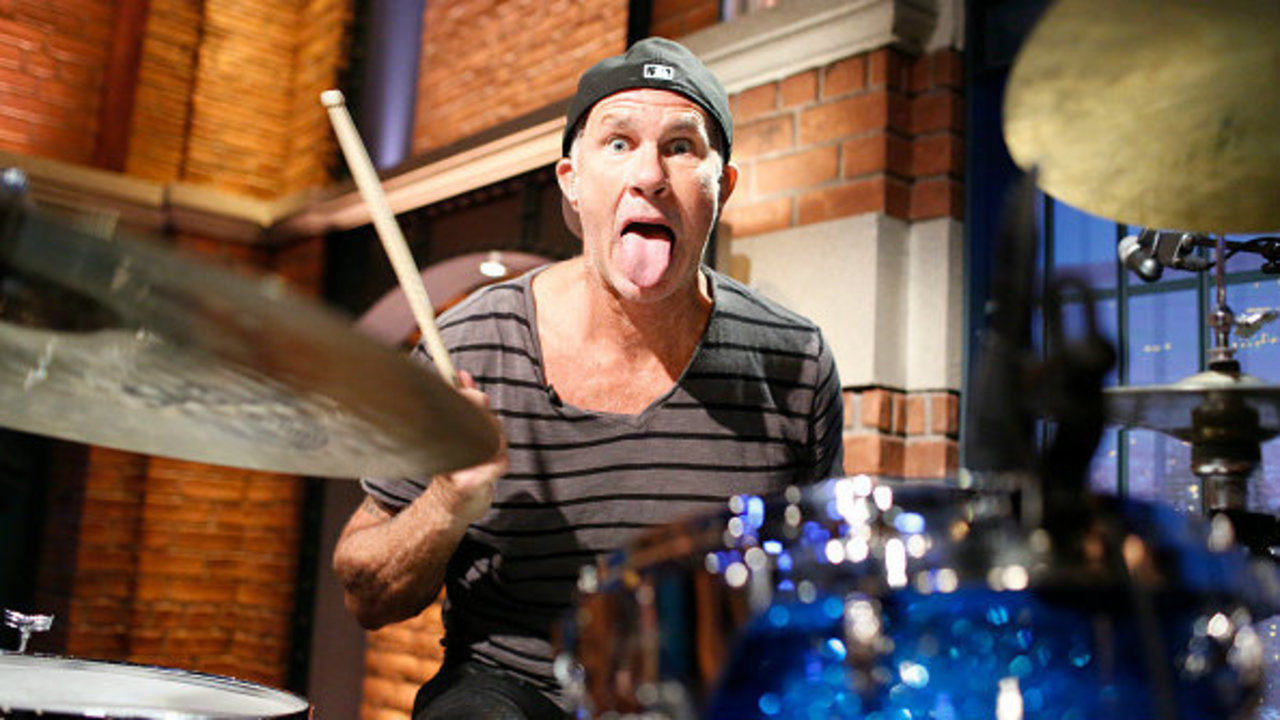 Red Hot Chili Peppers drummer sings Michigan fight song at...